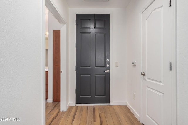 entryway with light hardwood / wood-style flooring