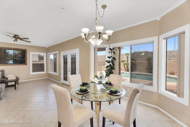 dining room featuring light tile patterned floors, crown molding, baseboards, french doors, and ceiling fan with notable chandelier