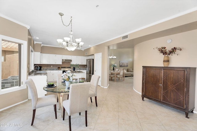dining space with a chandelier, light tile patterned flooring, visible vents, baseboards, and ornamental molding