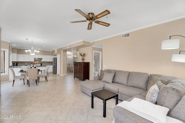 living area featuring crown molding, visible vents, light tile patterned floors, and ceiling fan with notable chandelier