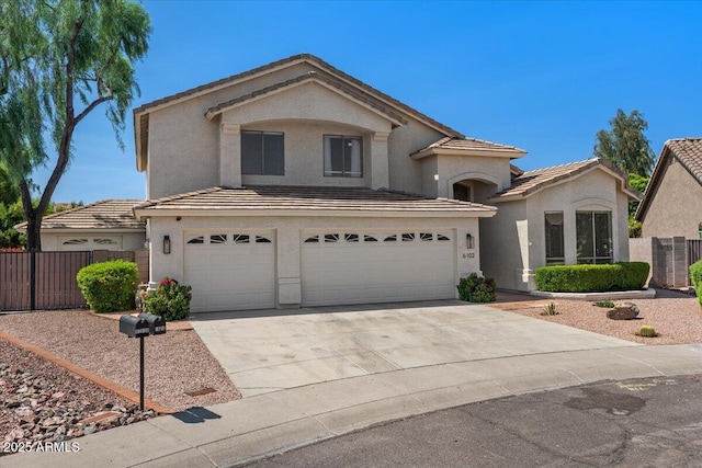6102 E Danbury Rd, Scottsdale, AZ 85254 - view of front of property with an attached garage, stucco siding, concrete driveway, and a tile roof