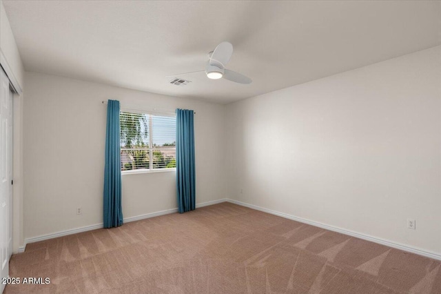 6102 E Danbury Rd, Scottsdale, AZ 85254 - spare room featuring light carpet and ceiling fan