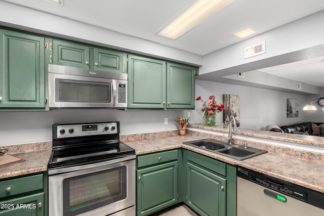 2121 W Union Hills Dr Unit 113, Phoenix, AZ 85027 - kitchen featuring appliances with stainless steel finishes, a sink, light countertops, and open floor plan