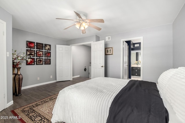 2121 W Union Hills Dr Unit 113, Phoenix, AZ 85027 - bedroom with dark wood-type flooring, baseboards, connected bathroom, and ceiling fan