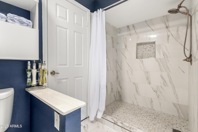 2121 W Union Hills Dr Unit 113, Phoenix, AZ 85027 - bathroom with toilet, tiled shower, and marble look tiles