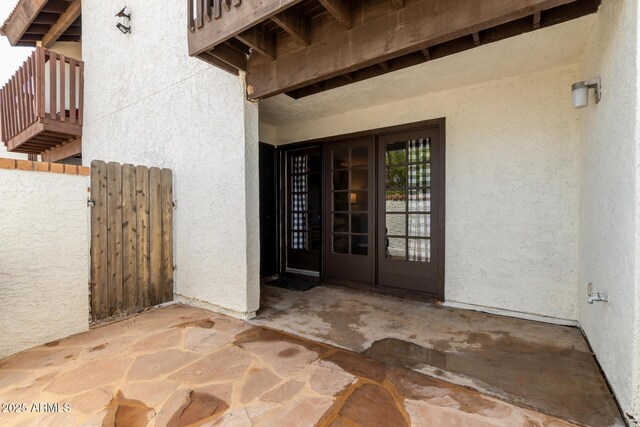 2121 W Union Hills Dr Unit 113, Phoenix, AZ 85027 - view of exterior entry featuring french doors, stucco siding, a patio area, and a gate