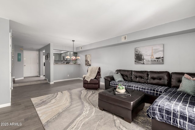 2121 W Union Hills Dr Unit 113, Phoenix, AZ 85027 - living area with baseboards and wood finished floors