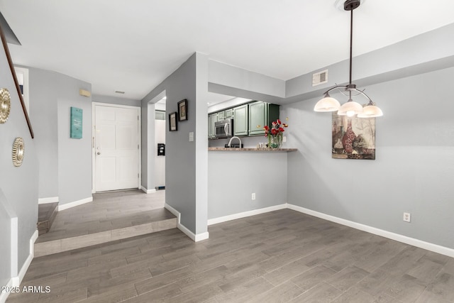 2121 W Union Hills Dr Unit 113, Phoenix, AZ 85027 - entrance foyer with wood finished floors and baseboards