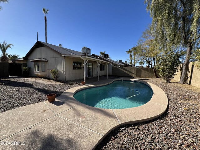 1770 E Sandra Ter, Phoenix, AZ 85022 - view of pool featuring central AC, a diving board, and a patio