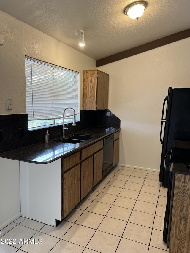 1770 E Sandra Ter, Phoenix, AZ 85022 - kitchen with black appliances, sink, vaulted ceiling, light tile patterned floors, and a textured ceiling