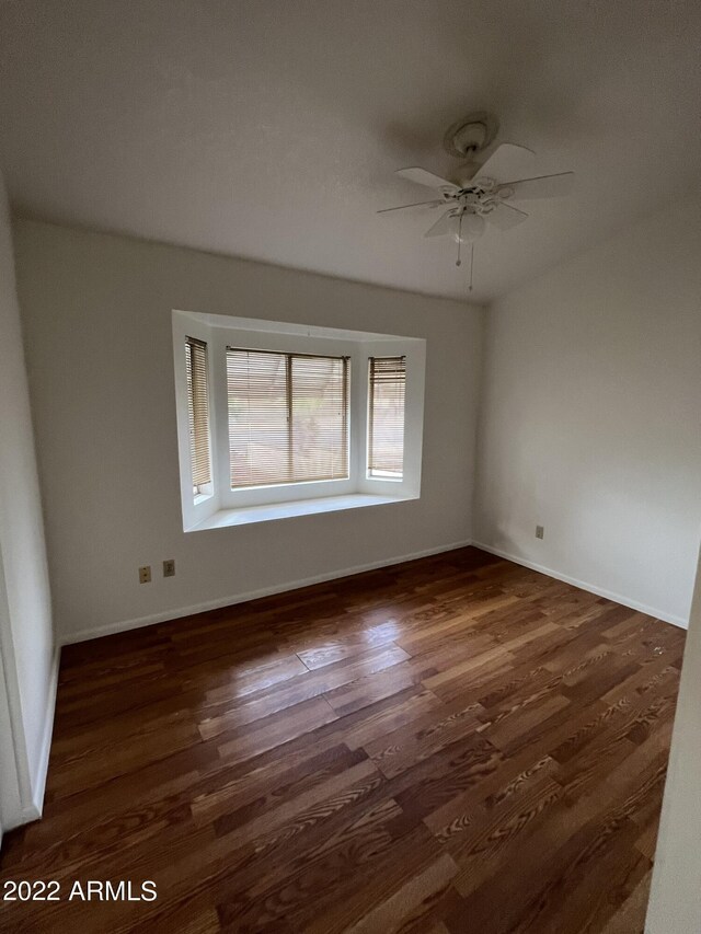 1770 E Sandra Ter, Phoenix, AZ 85022 - unfurnished room featuring ceiling fan and dark wood-type flooring