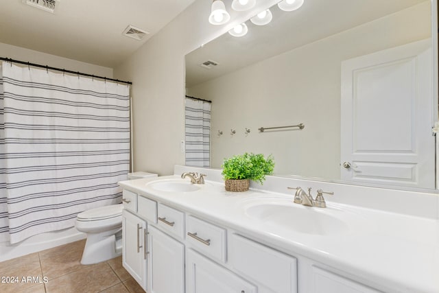 full bathroom featuring vanity, toilet, shower / bath combo with shower curtain, and tile patterned flooring