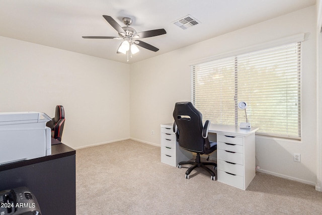 carpeted office featuring a healthy amount of sunlight and ceiling fan