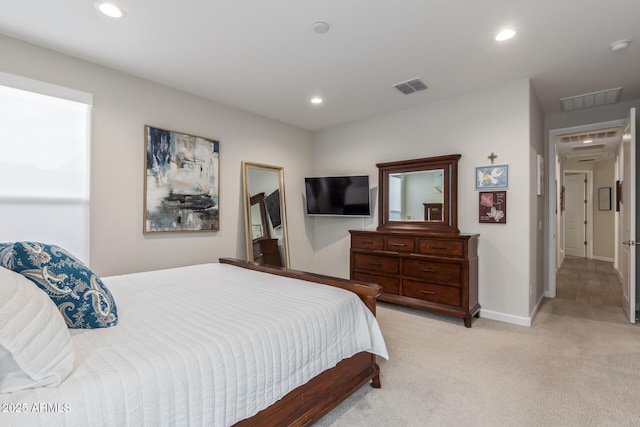 bedroom featuring light colored carpet