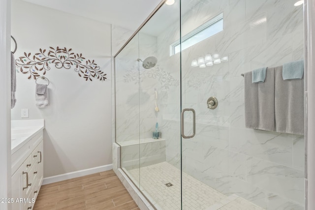 bathroom with vanity and a shower with door