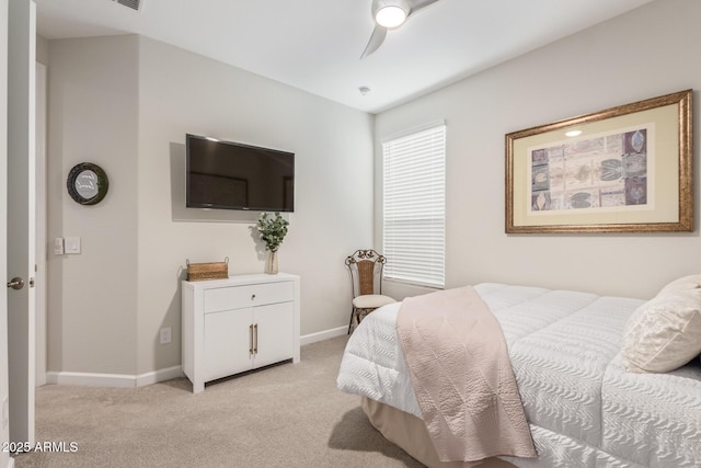 bedroom with ceiling fan and light carpet