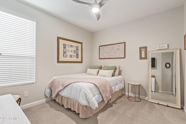 bedroom featuring light carpet and ceiling fan