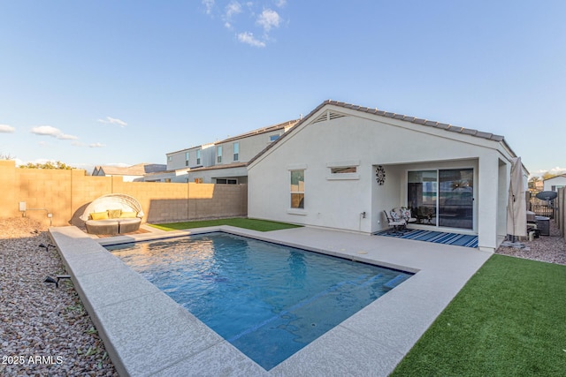 view of swimming pool with a patio area