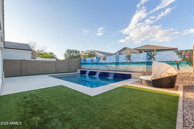 view of pool featuring pool water feature and a lawn