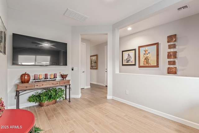 hall with light wood-type flooring