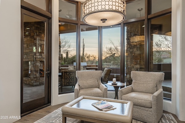 interior space featuring wood finished floors and floor to ceiling windows