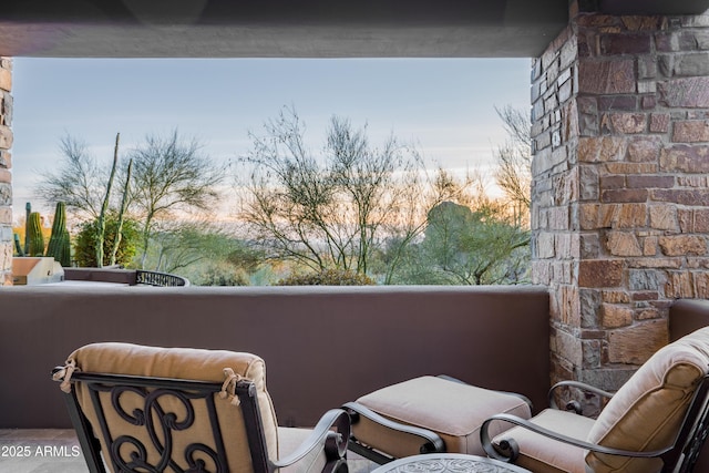 view of balcony at dusk