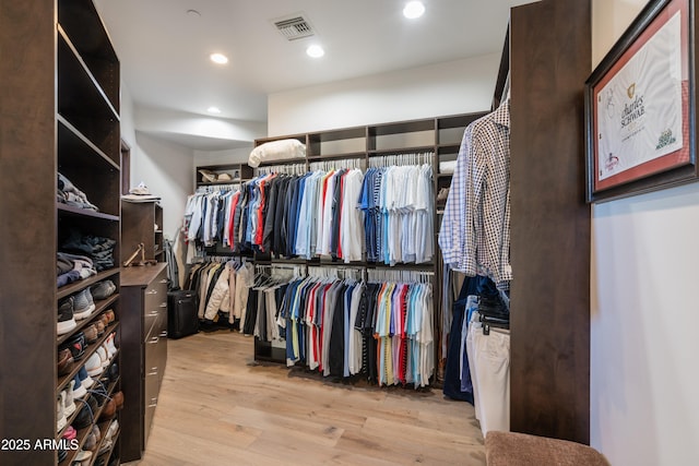 spacious closet featuring light wood-type flooring