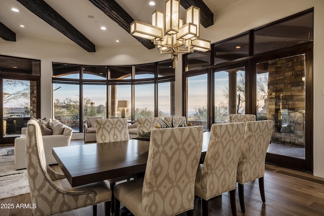 dining area with dark wood-type flooring, recessed lighting, beam ceiling, and a notable chandelier