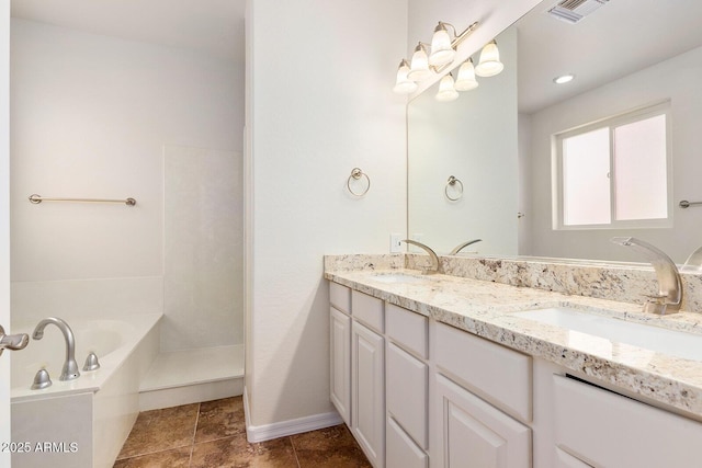 bathroom with vanity and a tub