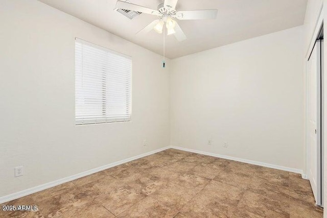 unfurnished room with ceiling fan