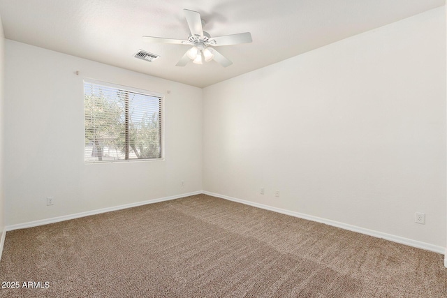 carpeted empty room featuring ceiling fan