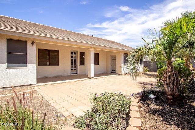 back of house with a patio area