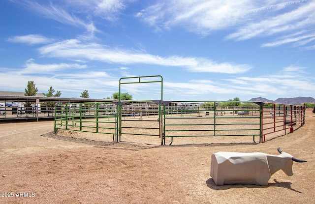 view of stable featuring a rural view