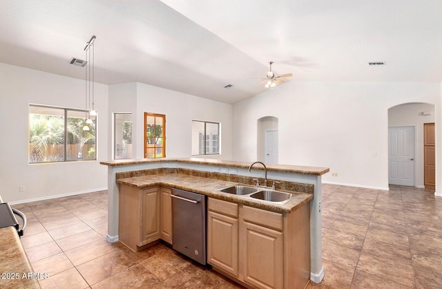 kitchen featuring vaulted ceiling, ceiling fan, an island with sink, and sink