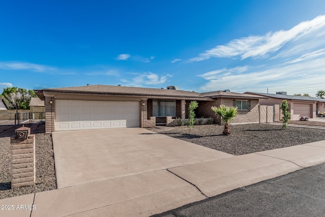 ranch-style house with brick siding, driveway, and an attached garage