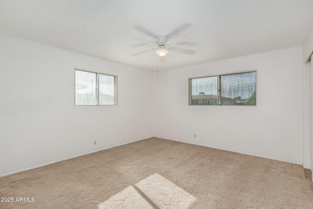 unfurnished room featuring carpet flooring and ceiling fan