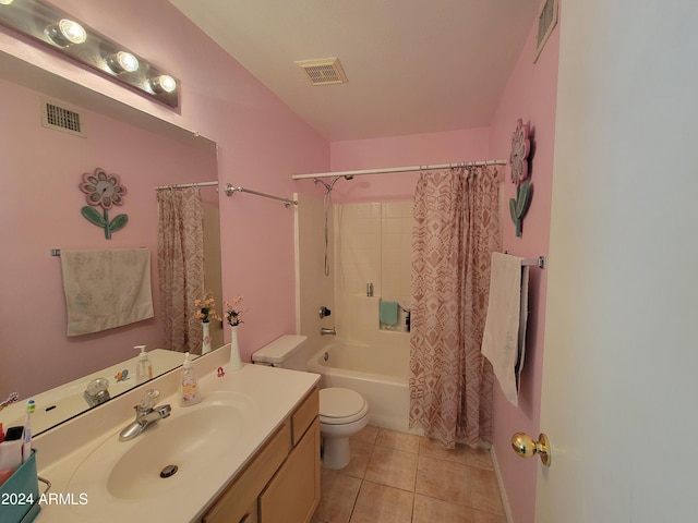 full bathroom with vanity, toilet, tile floors, and shower / bath combo with shower curtain