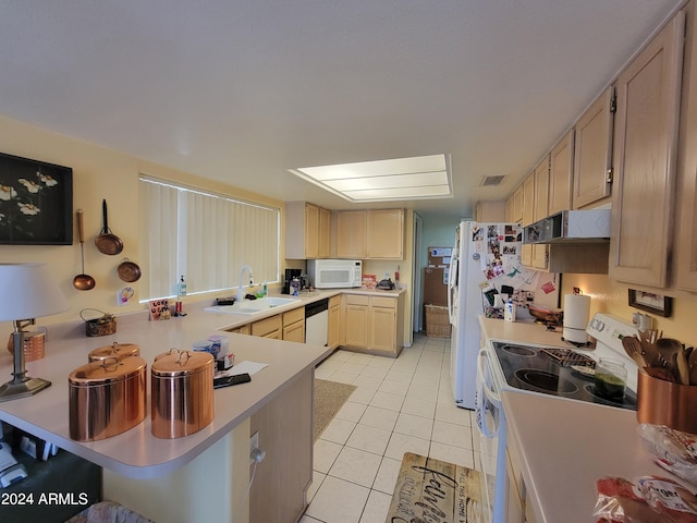 kitchen with wall chimney exhaust hood, white appliances, light brown cabinetry, light tile floors, and sink