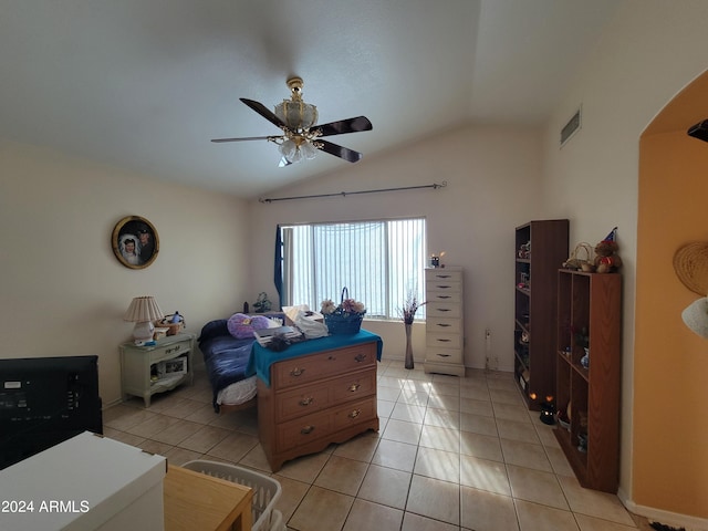 bedroom featuring lofted ceiling, ceiling fan, and light tile floors