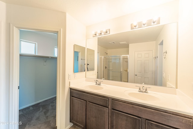 bathroom with vanity and an enclosed shower