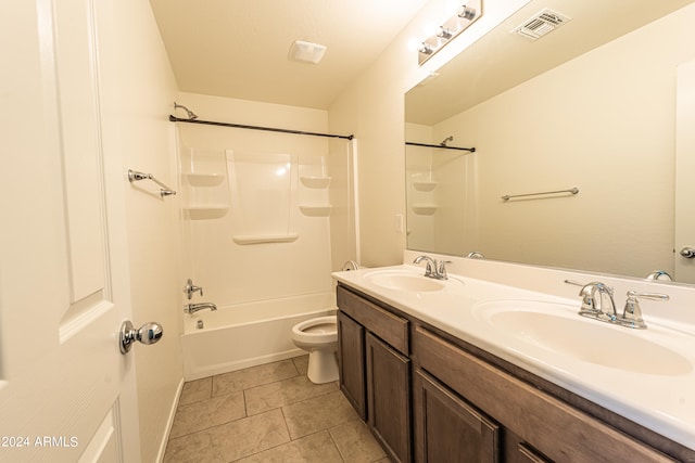 full bathroom featuring tile patterned flooring, vanity, toilet, and  shower combination