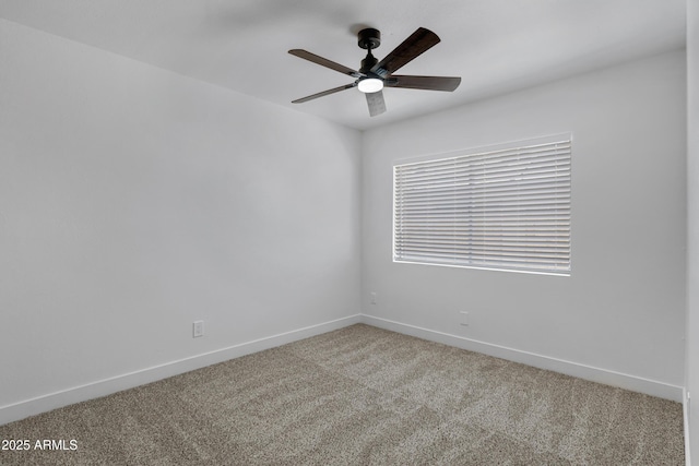 unfurnished room featuring ceiling fan and carpet flooring