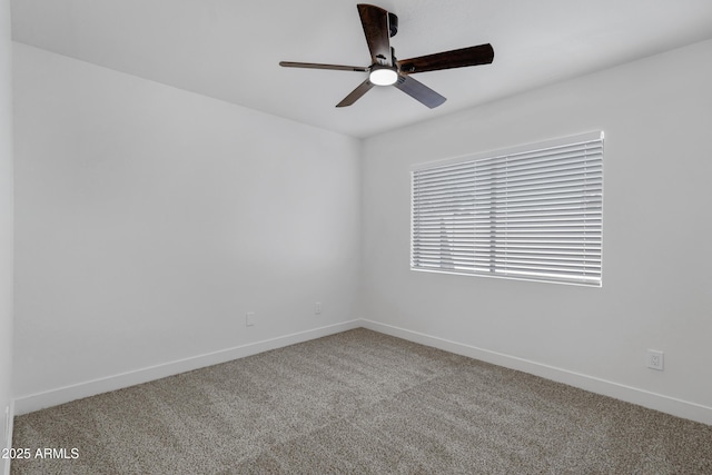 empty room with ceiling fan and carpet