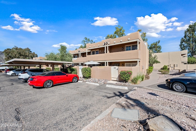 view of front of property with a carport