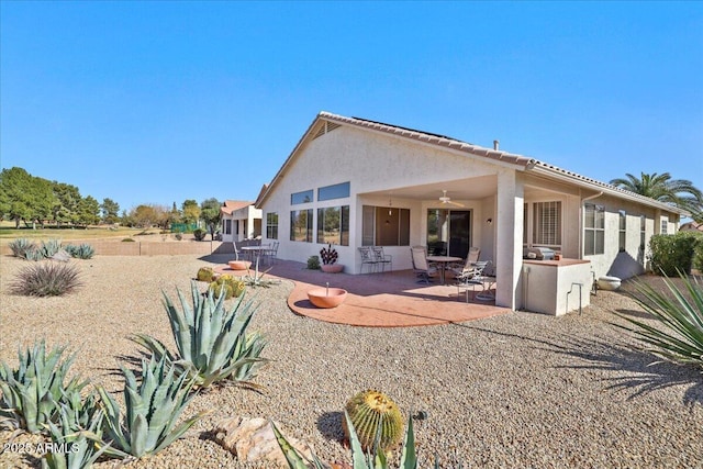 back of property featuring a patio area