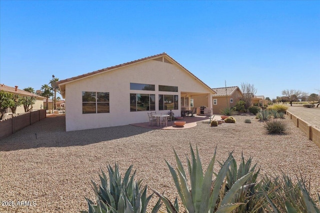 rear view of house featuring a patio area