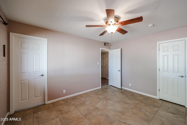 unfurnished bedroom featuring ceiling fan