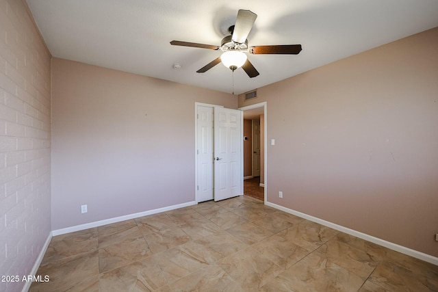 empty room featuring ceiling fan