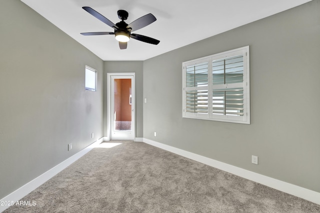 carpeted empty room featuring ceiling fan