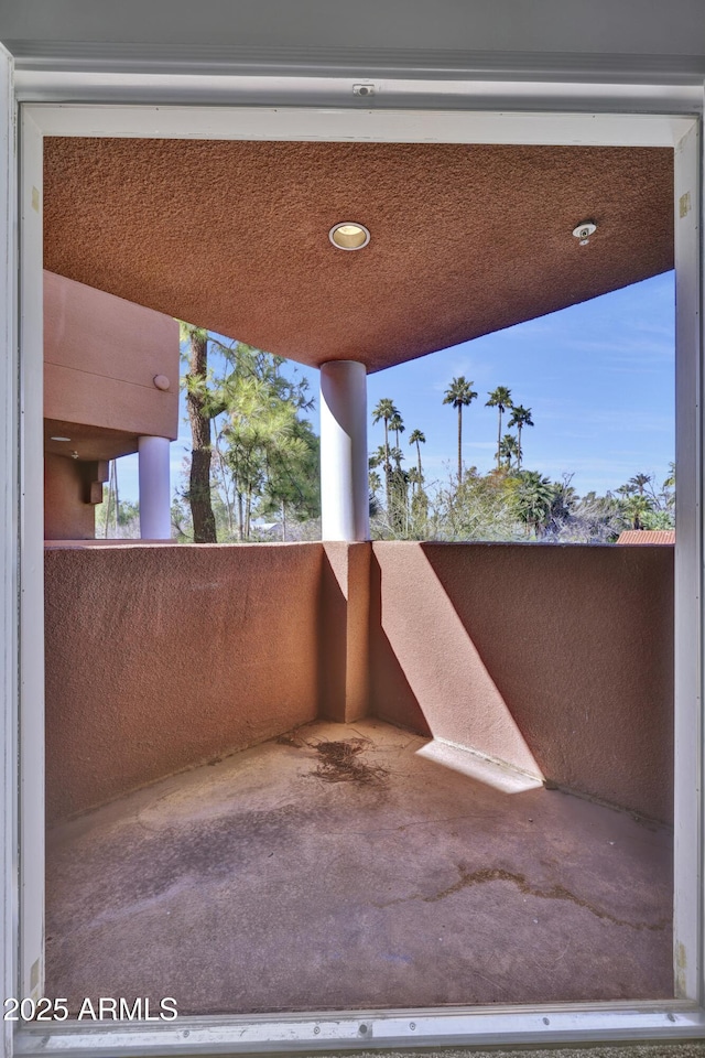 view of patio featuring a balcony